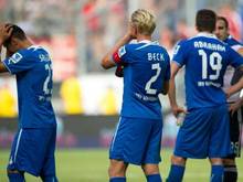 Die Hoffenheimer Sejad Salihovic (l-r), Andreas Beck und David Abraham sind vom 2:2 gegen Nürnberg enttäuscht. Foto: Uwe Anspach