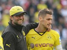 Trainer Jürgen Klopp (l.) setzt auf Mannschaftskapitän Sebastian Kehl