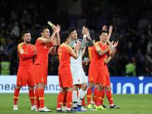 Chinas Spieler jubeln über den Einzug ins Viertelfinale des Asien-Cups