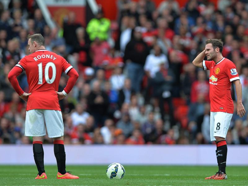 Auch Wayne Rooneys (l.) Treffer konnte Manchesters Niederlage gegen Swansea City nicht verhindern. Foto: Peter Powell