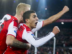 Bilal Başaçıkoğlu en Lex Immers vieren een treffer van Feyenoord in de wedstrijd tegen FC Dordrecht in de Eredivisie. (22-11-14)