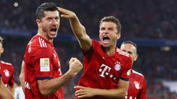 Thomas Müller (r.) glaubt an den Champions-League-Titel mit dem FC Bayern