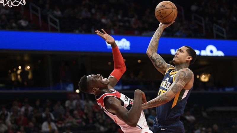 Isaac Bonga (l.) verlor mit den Washington Wizards gegen Utah Isaac Bonga (l.) verlor mit den Washington Wizards gegen Utah
