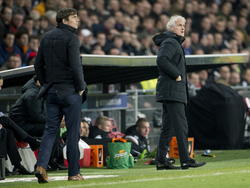 PSV-trainer Phillip Cocu (l.) en Feyenoord-trainer Fred Rutten (r.) bekijken het competitieduel PSV - Feyenoord. (17-12-2014)