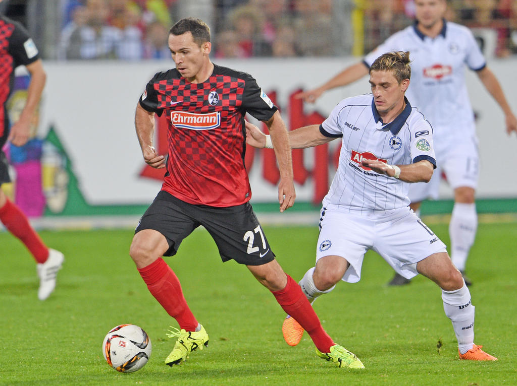 Nicolas Höfler (l.) bleibt dem SC Freiburg langfristig erhalten