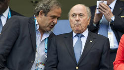 Photo combo of Michel Platini (L) and former FIFA president Sepp Blatter (R)