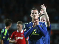 Arkadiusz Milik (voor) en Davy Klaassen (achter) bedanken het meegereisde publiek na de competitiewedstrijd tegen FC Twente. (18-10-2014)