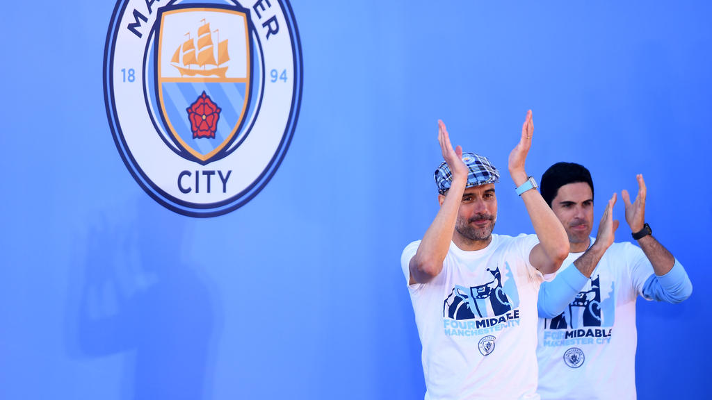 Guardiola y Arteta celebrando un título del City.