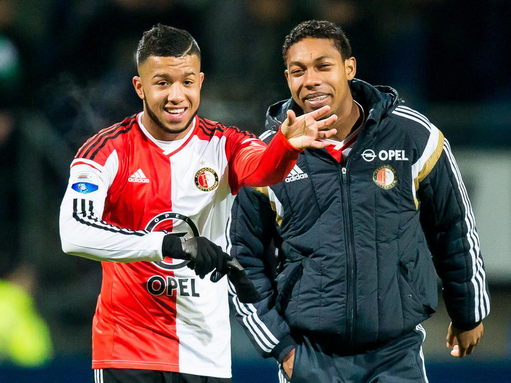 Tonny Vilhena (l.) en Jean-Paul Boëtius kunnen lachen na afloop van het competitieduel Excelsior - Feyenoord. (06-12-2014)