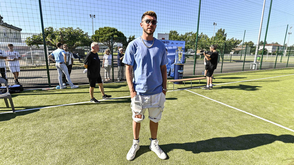 Laporte to miss start of Man City's title defence