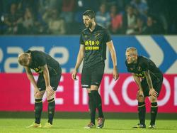 Henrico Drost (l.), Aleksandar Damčevski (m.) en Joeri de Kamps (r.) zijn behoorlijk teleurgesteld na het late tegendoelpunt van Willem II. (19-09-2014)