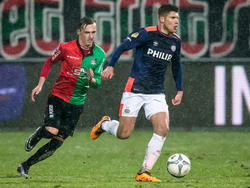 Marcel Ritzmaier (l.) is in de achtervolging bij Stijn Schaars (r.) tijdens de competitiewedstrijd NEC - PSV. (14-02-2016)