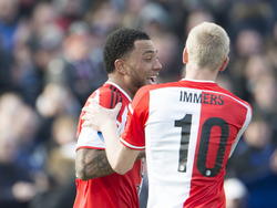 Colin Kâzim-Richards(l.) viert de 2-0 van Feyenoord tegen SC Cambuur samen met Lex Immers. (08-02-2015)