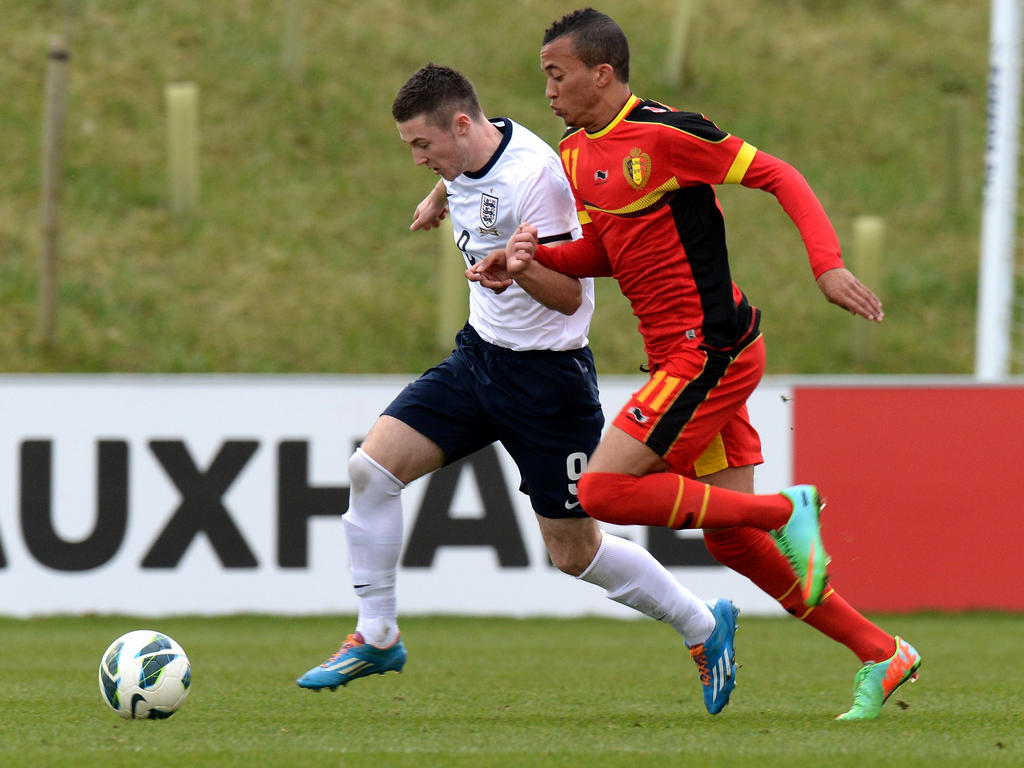 David Henen is challenged by Bradley Fewster