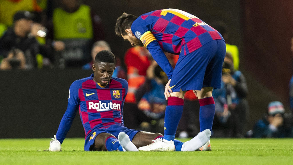 Ousmane Dembélé (l.) ist Lionel Messi angeblich ein Dorn im Auge