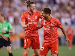 Bale y Asensio celebran uno de los dos goles anotados entre ellos. (Foto: Imago)