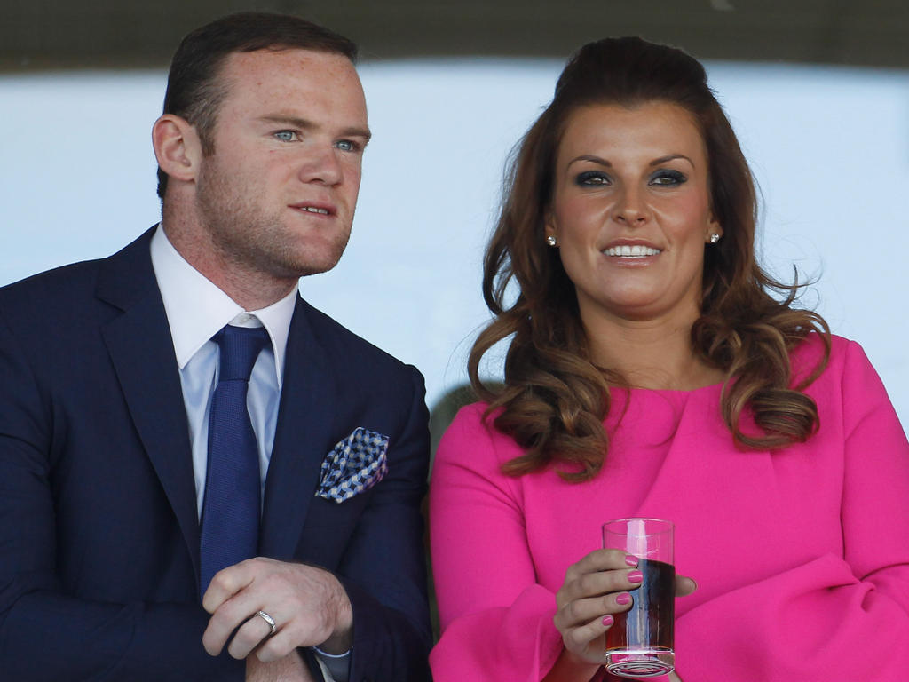 Englands Stürmer Wayne Rooney (l.) mit Frau Coleen