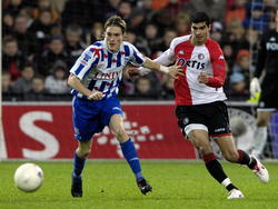 Karim Saïdi (r.) en Lasse Nilsson zoeken contact tijdens de wedstrijd Feyenoord - sc Heerenveen. (03-12-2006)