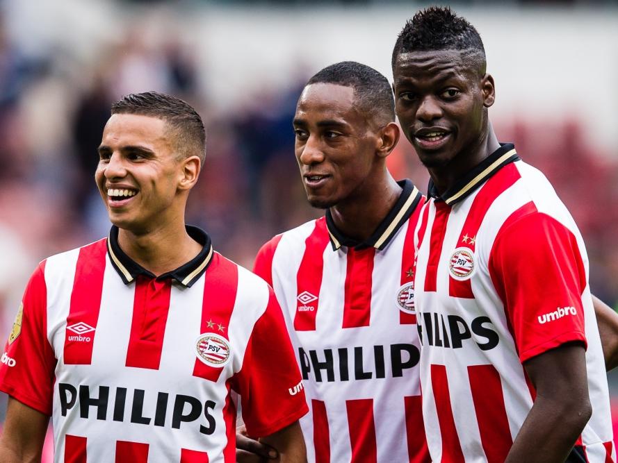 PSV'ers Adam Maher (l.), Joshua Brenet (m.) en Nicolas Isimat-Mirin (r.) genieten van de 2-0 overwinning op FC Groningen. (16-08-2015)