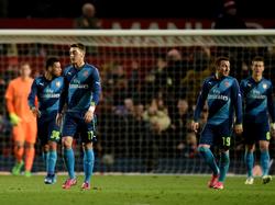Los jugadores del Arsenal tras el empate del Manchester. (Foto: Getty)