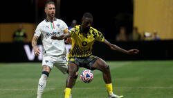 Serhou Guirassy bekam es mit der spanischen Legende Sergio Ramos (l.) zu tun