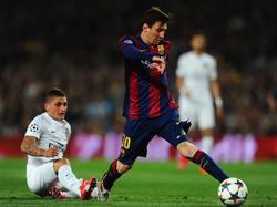 Marco Verrati contra Leo Messi en un partido de la Champions. (Foto: Getty)