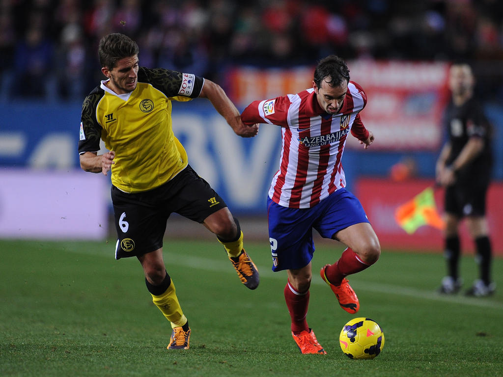 Daniel Carriço (l.) im Spiel gegen  Atlético Madrid
