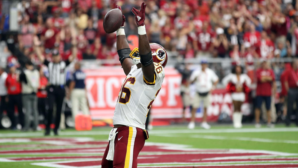 Adrian Peterson bejubelt seinen historischen Touchdown Adrian Peterson bejubelt seinen historischen Touchdown