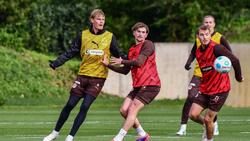 Der FC St. Pauli bindet mit Eric Smith (l.) einen wichtigen Spieler langfristig an den Verein