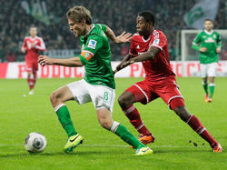 Bremens Kapitän Clemens Fritz (l.) musste die 0:7-Packung gegen den FC Bayern verdauen