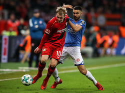 Leverkusens Brandt (li.) ist mit der Entwicklung seines Teams zufrieden
