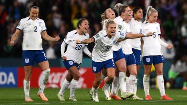 England's players celebrate after the winning penalty