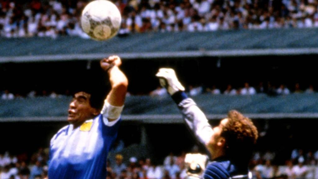 Argentinian football legend Diego Maradona (C) dribbles past three English defenders at the World Cup quarterfinal  match between Argentina and England in 1986