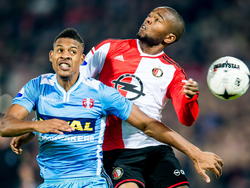 Miquel Nelom (r.) van Feyenoord vecht een luchtduel uit met FC Dordrecht-speler Rihairo Meulens. (22-11-2014)