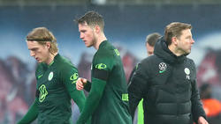 Um Wolfsburgs Mittelstürmer Weghorst (M.) ranken sich Wechselgerüchte