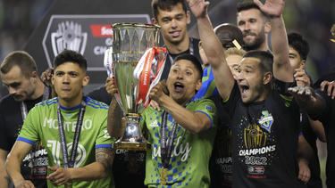Seattle Sounders forward Raul Ruidiaz celebrates with teammates after his second goal effectively seals victory in the CONCACAF Champions League final