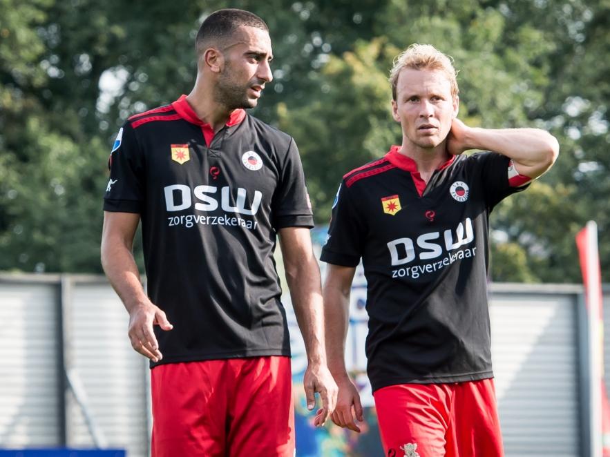 Adil Auassar (l.) en Rick Kruys (r.) druipen teleurgesteld af na afloop van het competitieduel Excelsior - Ajax. (20-09-2015)