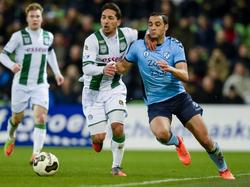 FC Groningen-speler Tom Hiariej (l.) in duel met FC Utrecht-speler Sofyan Amrabat. (25-02-2017)
