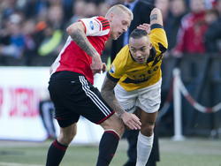 Feyenoord speler Lex Immers (l.) in duel met NAC speler Demy de Zeeuw (r.). (08-03-2015)