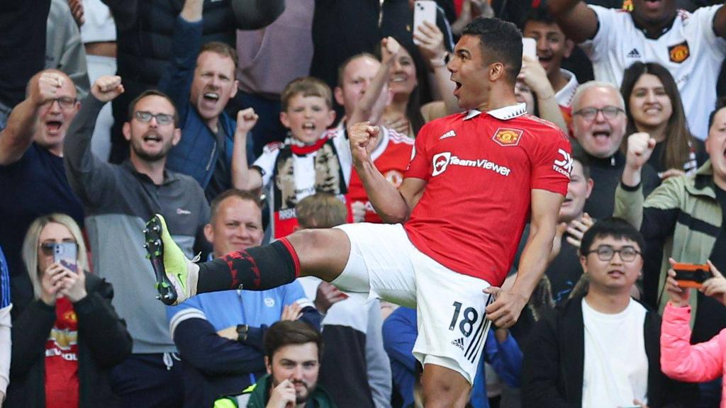 Starring role: Casemiro celebrates his  goal as Manchester United thrash Chelsea 4-1 to secure a return to the Champions League next season