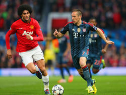 Marouane Fellaini (l) hier in een duel met de Fransman Franck Ribery (r). (1-4-2014)
