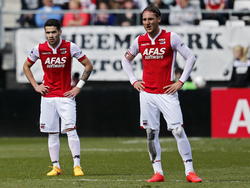 Zichtbare teleurstelling bij AZ-spelers Celso Ortiz (l.) en Nemanja Gudelj (r.) na afloop van de wedstrijd tegen Feyenoord. (05-04-2015)