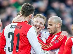 Michiel Kramer (l.), Dirk Kuyt (m.) en Karim El Ahmadi komen bij elkaar om het doelpunt van Feyenoord tegen SC Cambuur te vieren. (06-03-2016)