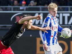 Excelsior speler Sander Fischer (l.) in duel met Speler van Heerenveen Morten Thorsby (r.). (01-03-2015)