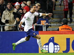 Cristiano Ronaldo viert zijn winnende treffer in de blessuretijd van het EK-kwalificatieduel Denemarken - Portugal. (14-10-2014)
