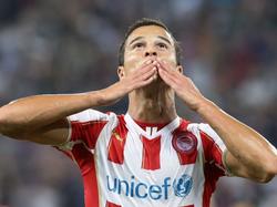 Een dubbele handkus van vreugde na de 2-0 van Ibrahim Afellay tijdens het Champions League-duel Olympiakos - Atlético Madrid. (19-09-2014) 