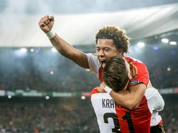 Tonny Vilhena springt in de armen van Michiel Kramer nadat Feyenoord op een 1-0 voorsprong is gekomen door een eigen doelpunt van Markus Henriksen tegen AZ in de halve finale van de KNVB beker. (03-03-2016)