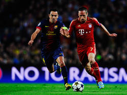 Xavi und Riéry kennen sich noch aus der Champions League