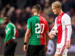 Ajax-spits Kasper Dolberg (r.) scoort een hattrick tegen NEC, dus mag hij de bal mee naar huis nemen. (20-11-2016)