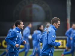 Otman Bakkal (l.) en Stefan de Vrij beginnen aan de warming-up voor de training van Feyenoord. (03-03-2014)